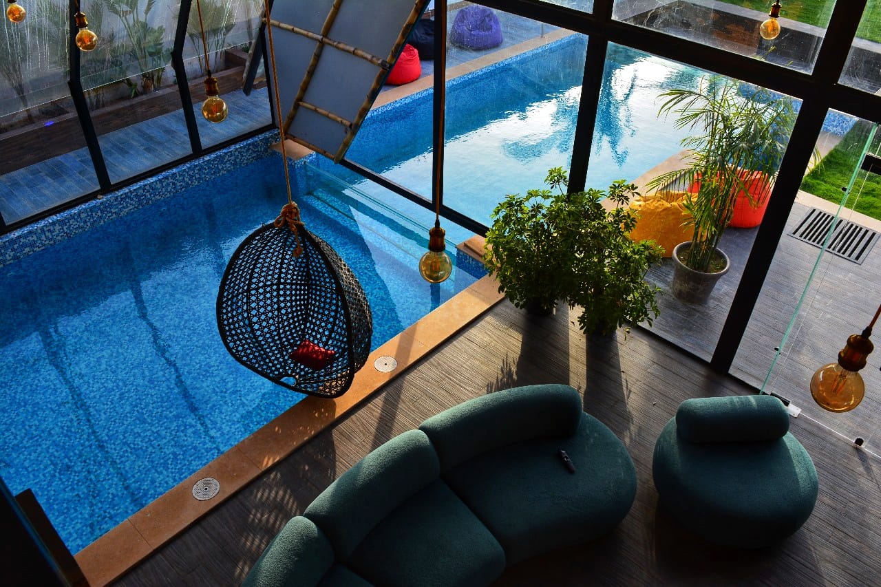Aerial view of indoor pool with lounge area